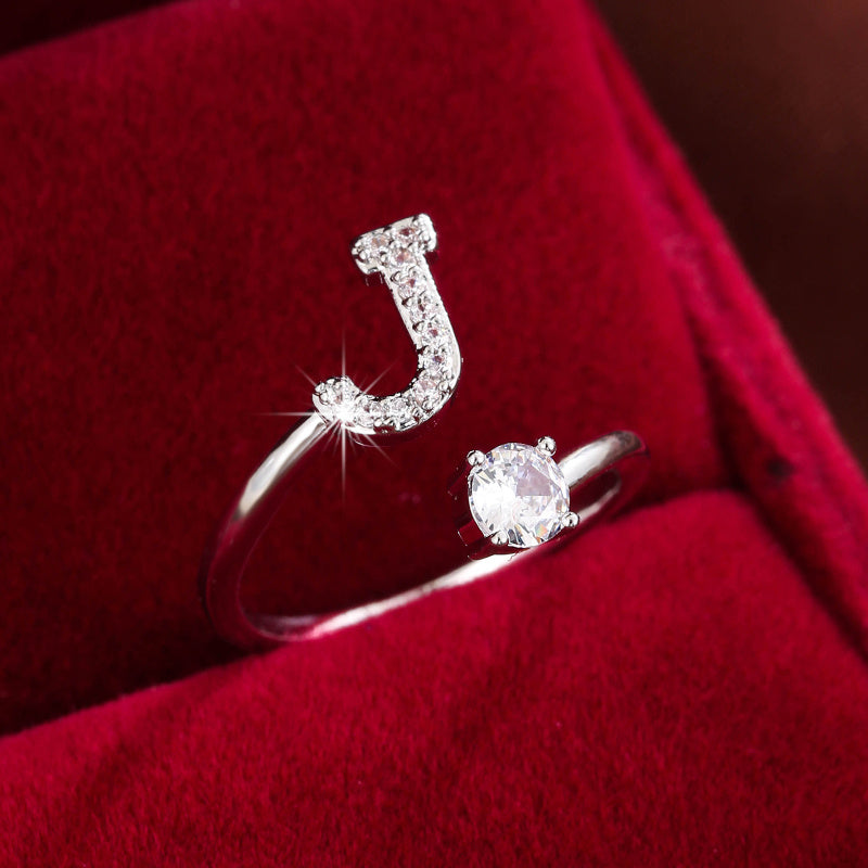 Adjustable Copper Ring With Four-claw Round Zirconia, Featuring The 26 English Letters Of Fashion Trend.