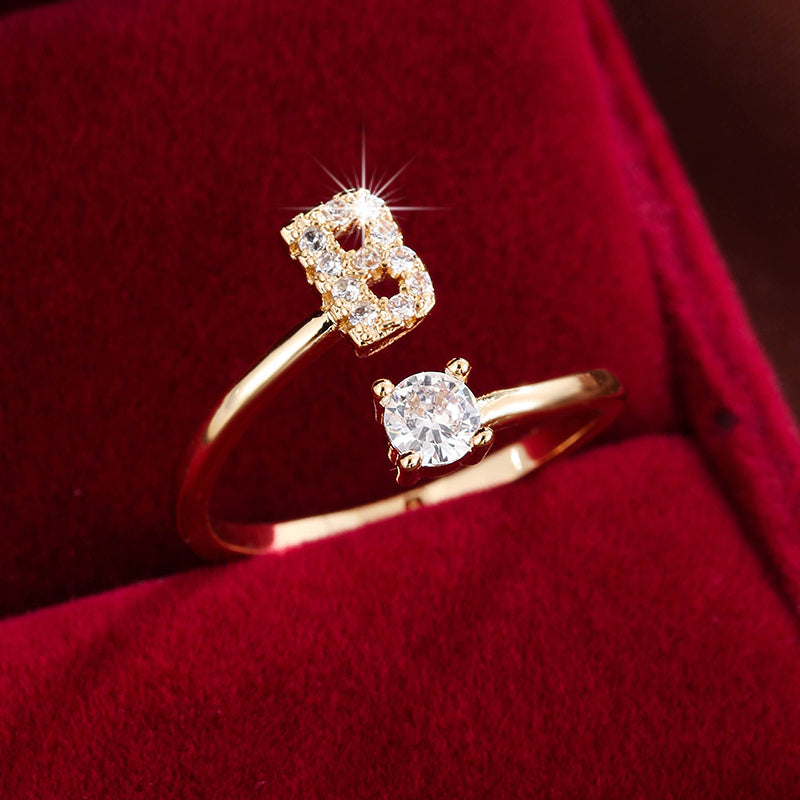 Adjustable Copper Ring With Four-claw Round Zirconia, Featuring The 26 English Letters Of Fashion Trend.