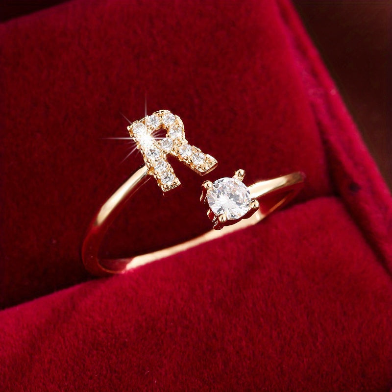 Adjustable Copper Ring With Four-claw Round Zirconia, Featuring The 26 English Letters Of Fashion Trend.