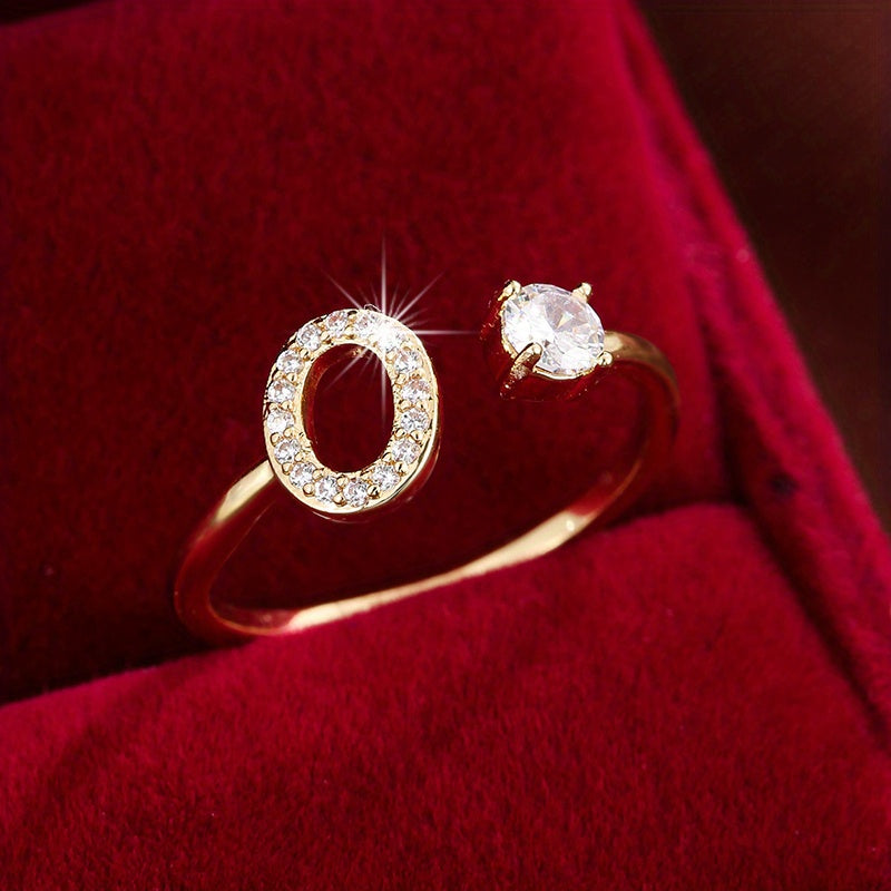 Adjustable Copper Ring With Four-claw Round Zirconia, Featuring The 26 English Letters Of Fashion Trend.