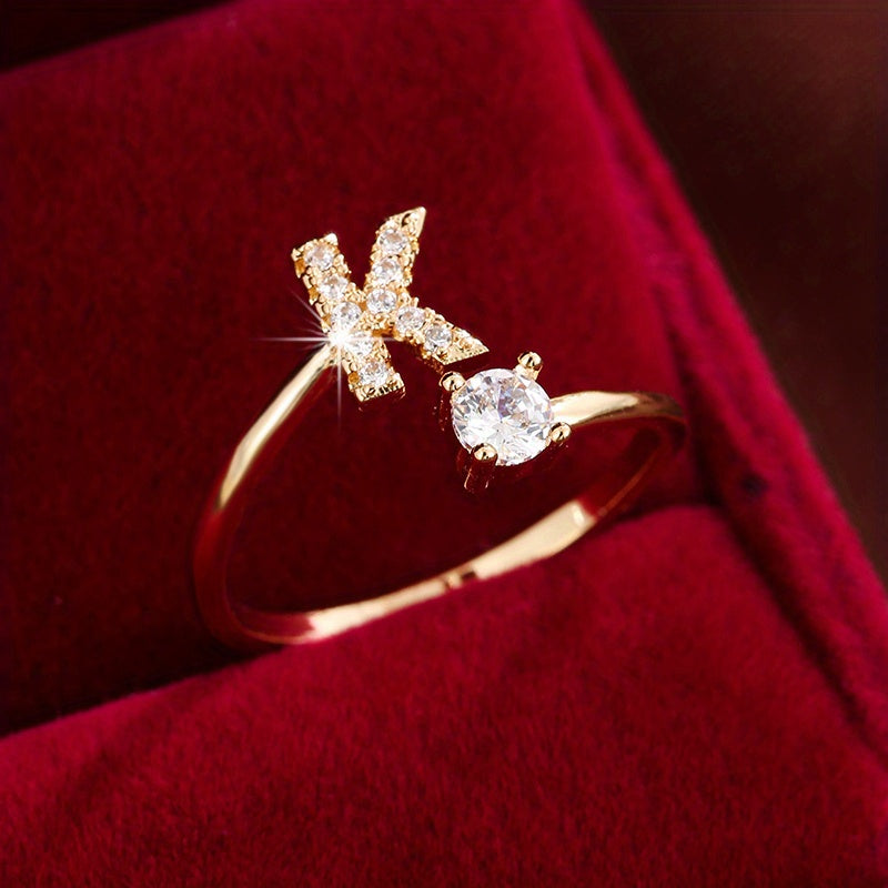 Adjustable Copper Ring With Four-claw Round Zirconia, Featuring The 26 English Letters Of Fashion Trend.