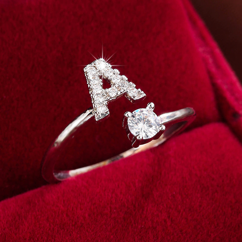 Adjustable Copper Ring With Four-claw Round Zirconia, Featuring The 26 English Letters Of Fashion Trend.