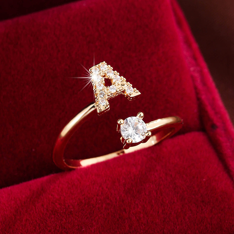 Adjustable Copper Ring With Four-claw Round Zirconia, Featuring The 26 English Letters Of Fashion Trend.