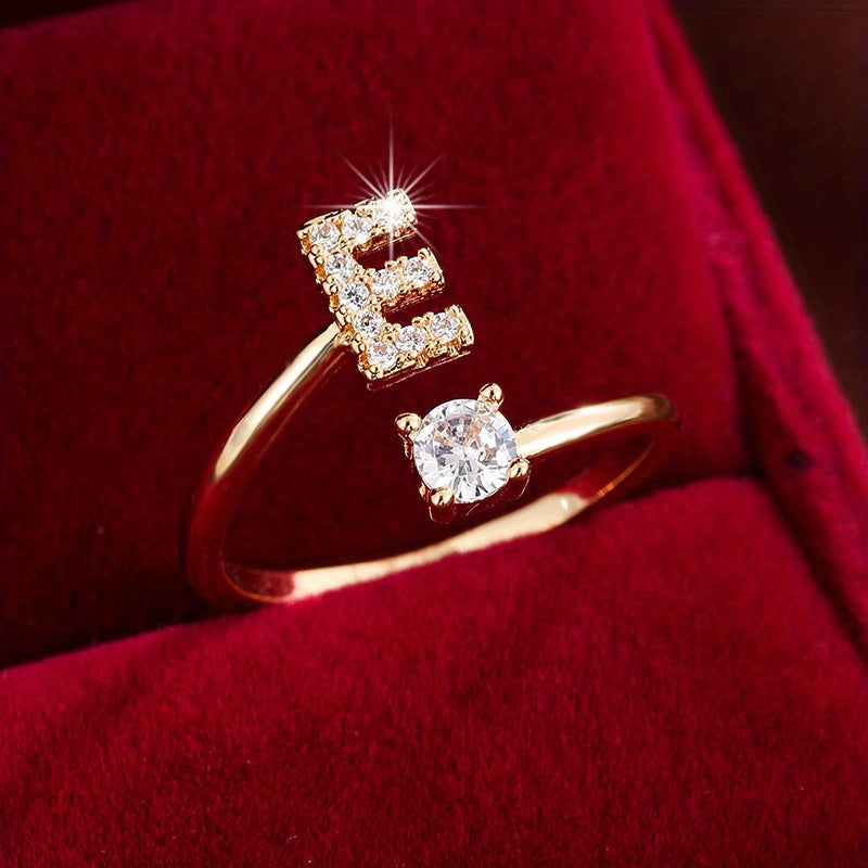 Adjustable Copper Ring With Four-claw Round Zirconia, Featuring The 26 English Letters Of Fashion Trend.