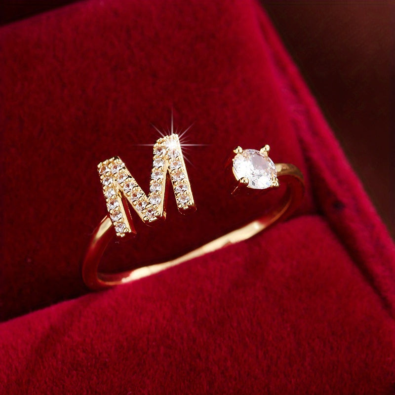 Adjustable Copper Ring With Four-claw Round Zirconia, Featuring The 26 English Letters Of Fashion Trend.