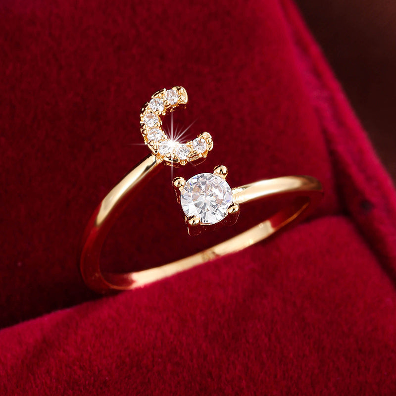 Adjustable Copper Ring With Four-claw Round Zirconia, Featuring The 26 English Letters Of Fashion Trend.