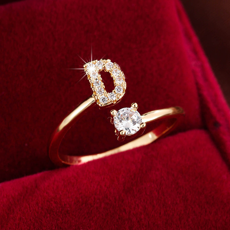 Adjustable Copper Ring With Four-claw Round Zirconia, Featuring The 26 English Letters Of Fashion Trend.