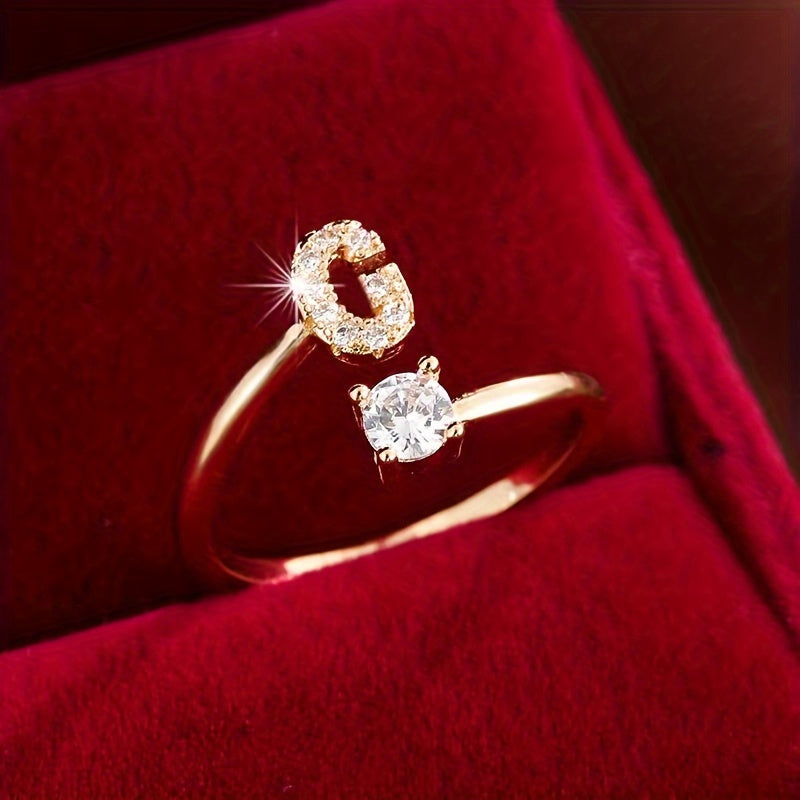 Adjustable Copper Ring With Four-claw Round Zirconia, Featuring The 26 English Letters Of Fashion Trend.
