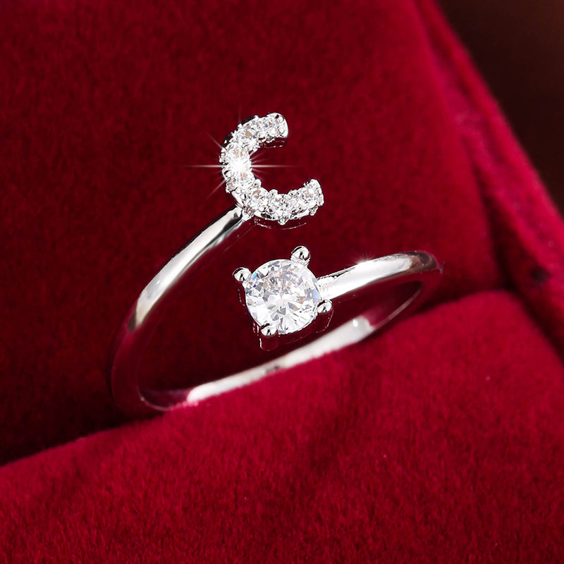 Adjustable Copper Ring With Four-claw Round Zirconia, Featuring The 26 English Letters Of Fashion Trend.