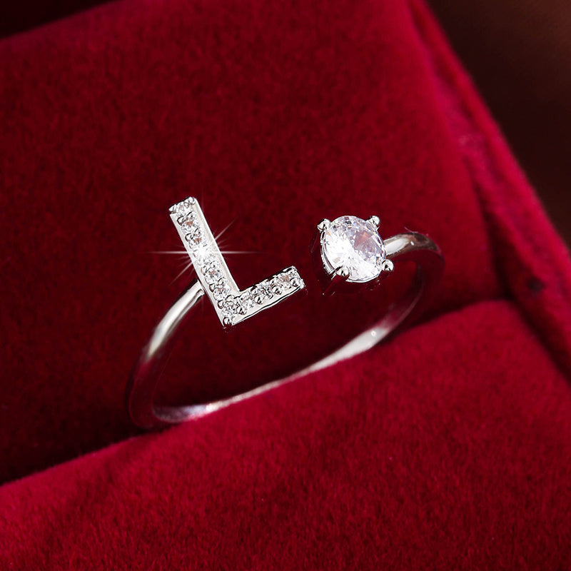 Adjustable Copper Ring With Four-claw Round Zirconia, Featuring The 26 English Letters Of Fashion Trend.
