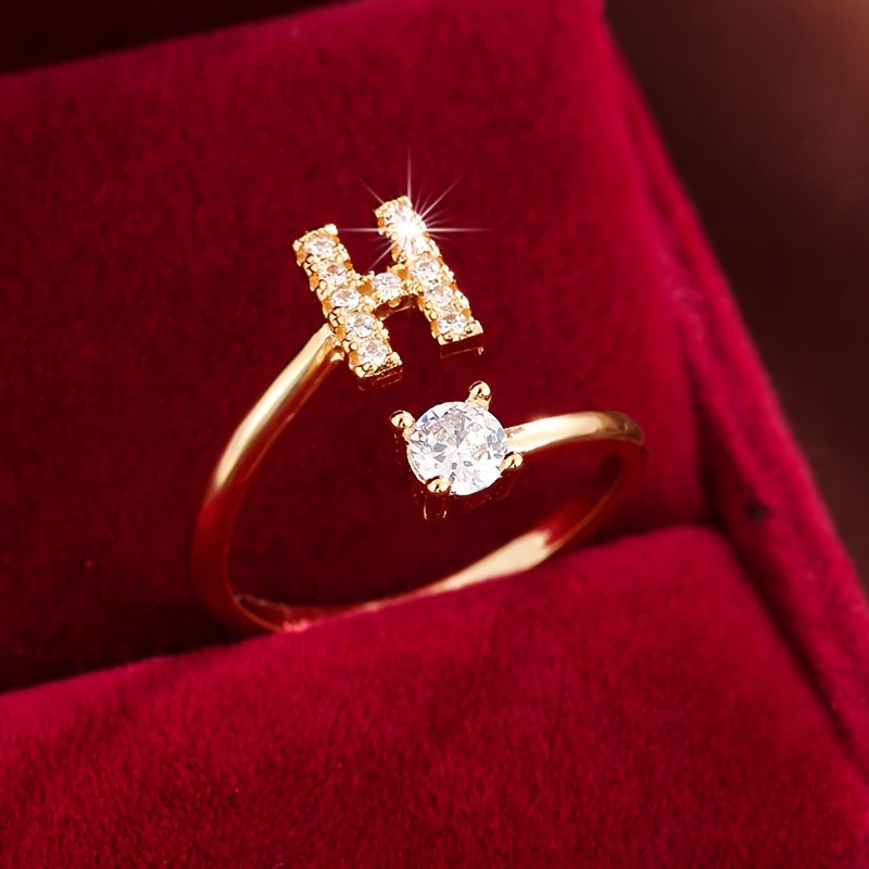 Adjustable Copper Ring With Four-claw Round Zirconia, Featuring The 26 English Letters Of Fashion Trend.