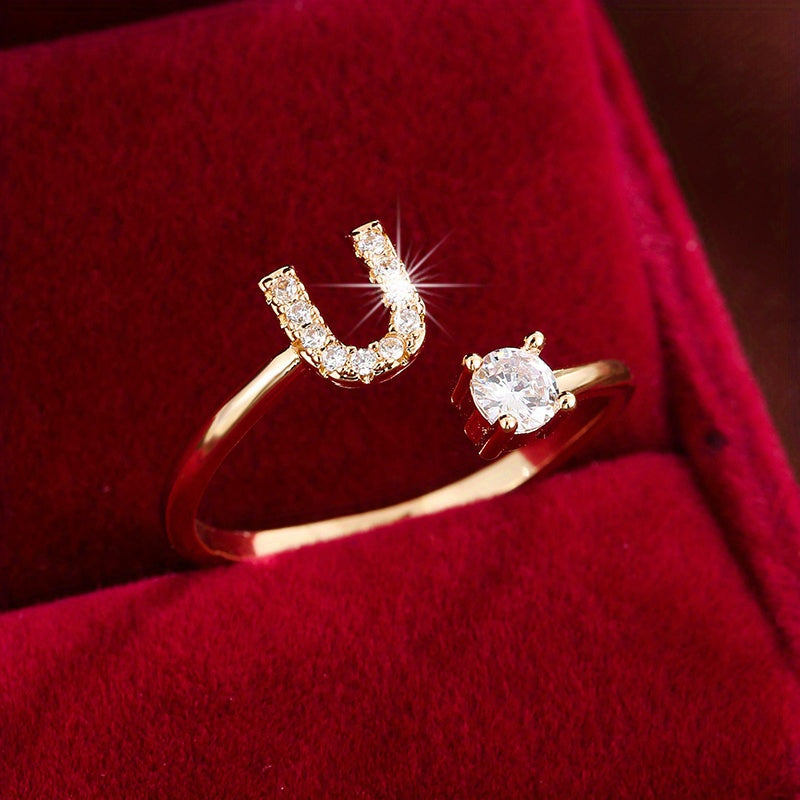 Adjustable Copper Ring With Four-claw Round Zirconia, Featuring The 26 English Letters Of Fashion Trend.