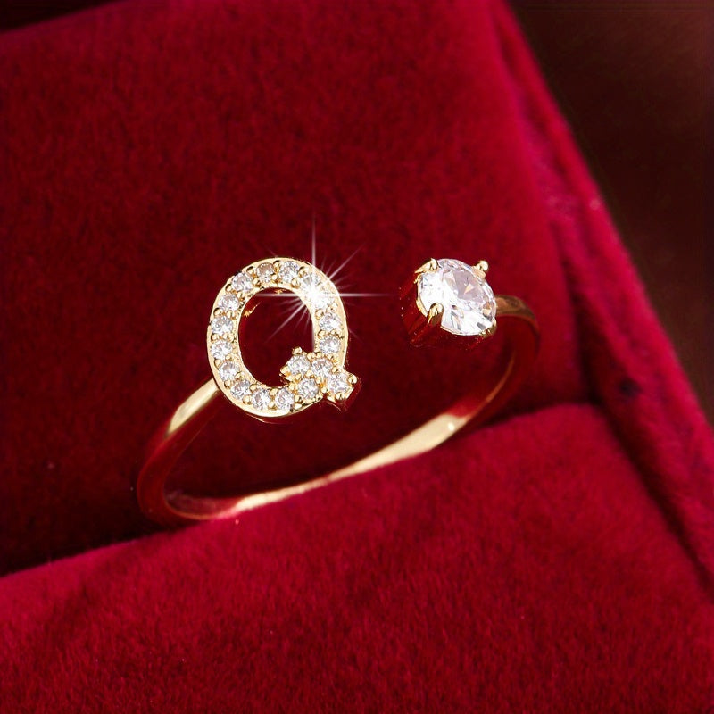 Adjustable Copper Ring With Four-claw Round Zirconia, Featuring The 26 English Letters Of Fashion Trend.